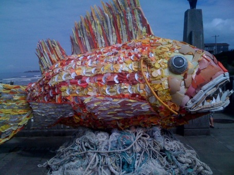 Giant 8 foot fish made from debris found on the beach